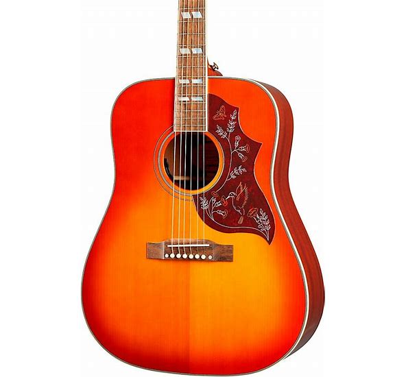 Photo of a Brown Guitar that is nice to look at A holy Guitar